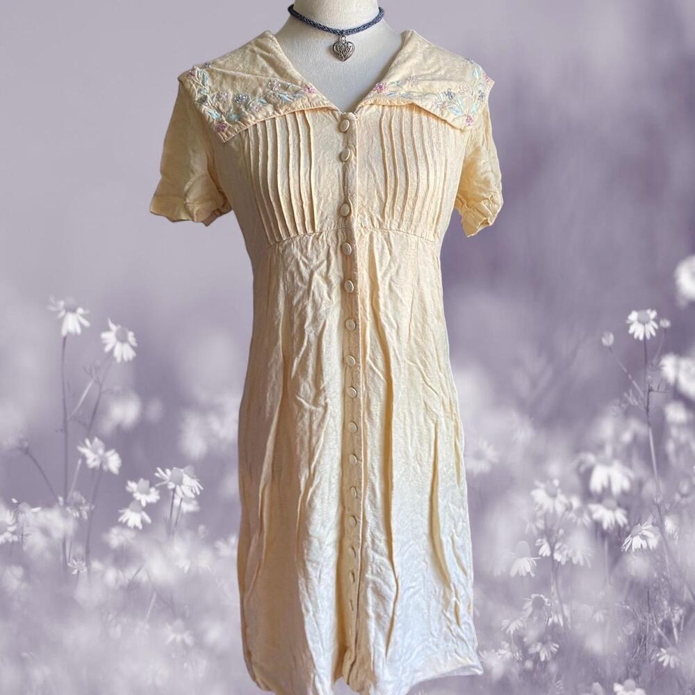 Yellow embroidered dress with a